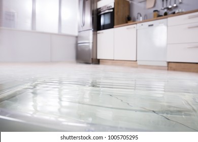 Close-up Photo Of Flooded Floor In Kitchen From Water Leak