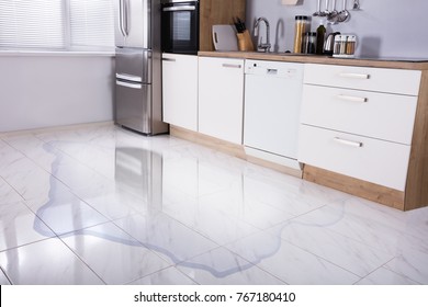 Close-up Photo Of Flooded Floor In Kitchen From Water Leak - Shutterstock ID 767180410