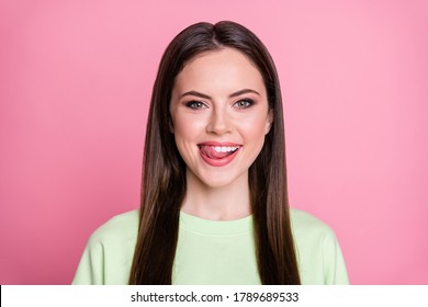 Closeup Photo Of Funny Attractive Lady Straight Long Hairdo Funny Girlish Licking Lips Tongue See Tasty Dessert Wear Casual Green Sweatshirt Pullover Isolated Pink Color Background