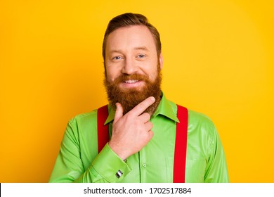 Closeup Photo Of Funny Red Head Guy Hold Arm On Chin Touch Soft Mustache Hair Metrosexual Person Wear Green Shirt Red Suspenders Isolated Yellow Color Background
