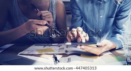 Closeup photo Girl Touching Screen Digital Tablet Hand.Project Producer Researching Process.Business Crew Working New Startup modern Studio.Analyze market stock,strategy.Blurred,film effect.Horizontal