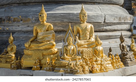 Close-up photo of golden yellow Buddha statue Shining with a beautiful aura, Asian art, Buddhist culture, Buddha