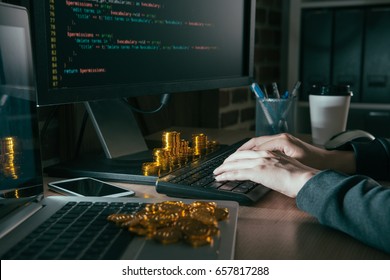 Closeup Photo Of Hacker Using Computer Internet Virus And Typing Data Steal Information In Order To Request Ransom Bitcoin Gold.