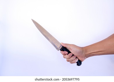 close-up photo of hand holding a knife on a white background.