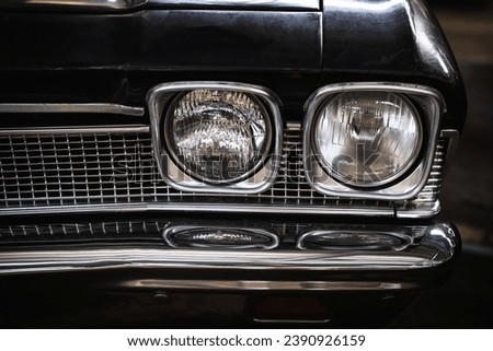 Close-up photo of headlights of an old classic car
