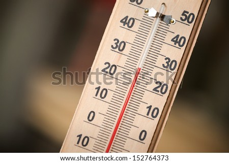 Closeup photo of household alcohol thermometer showing temperature in degrees Celsius
