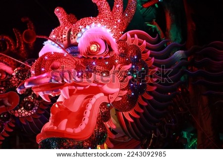 
close-up photo of Large Chinese dragon puppet head It is a popular show during the Chinese New Year.