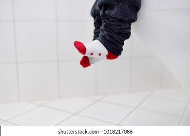 Close-up Photo Of Little Boy In Restroom. Toddler Child Trainig Use Toilet. Hygiene For Little Child. Kids Constipation/diarrhea Concept