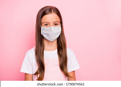 Closeup photo of little cute lady keep self-isolation wear fabric mask rose overall white t-shirt isolated pink background