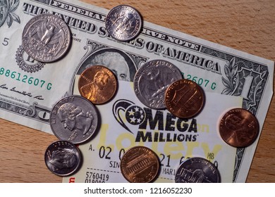 Closeup Photo Of Lottery Tickets Of Mega Millions With Dollar Bill And Coins, North Carolina, USA. October 30, 2018