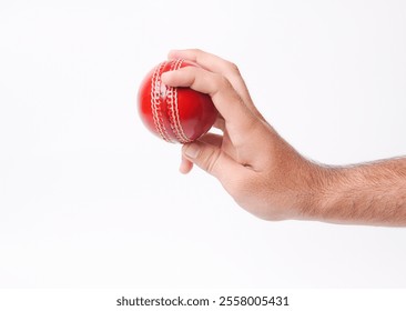 Closeup Photo Of A Male Bowler Firmly Gripping On A Red Test Match Cricket Ball On White Background - Powered by Shutterstock