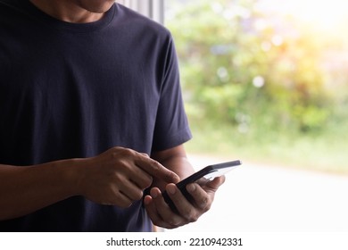 Close-up Photo Of Male Hands With A Smartphone. The Concept Of Using The Phone Is Essential In Everyday Life. 