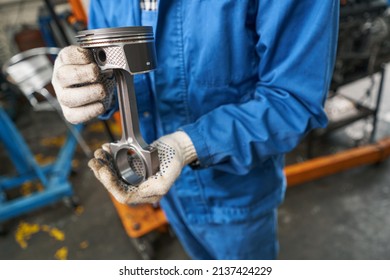 Close-up Photo Of Male Holding Car Part In His Hands