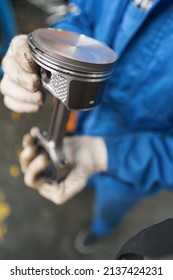 Close-up Photo Of Man Holding Car Part In His Hands