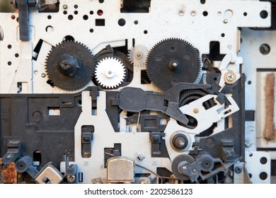 A Closeup Photo Of The Mechanism Of A Vintage Tape Player