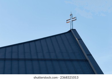 Close-up photo of a metal Cross on the roof of the Church of St. Nicholas the Bishop, Zagreb, Croatia - Powered by Shutterstock