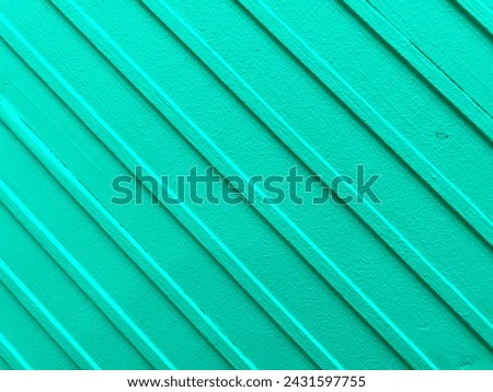 Close-up photo of a mint or pastel green wall surface with a diagonal pattern. Perfect for backgrounds, presentations, fabric patterns, table runners.