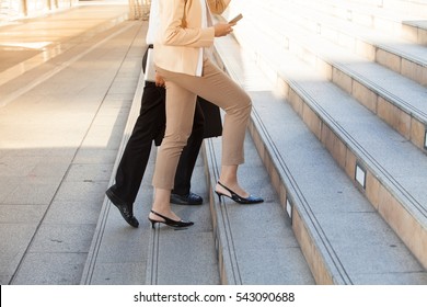 Closeup Photo Of Modern Businessman Walking Up The Stairs In Rush Hour To Work In A Hurry. During The First Morning Of Work.