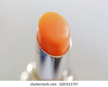 Closeup Photo Of Orange Lip Balm Wax Texture