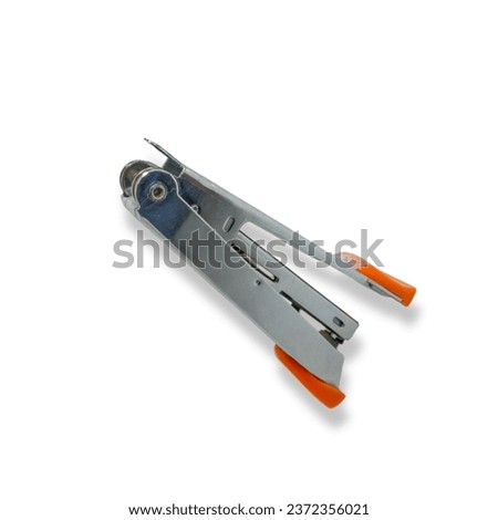 Close-up photo of an orange stapler, office stationery for study and work purposes on a white background