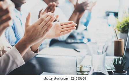 Closeup photo of partners clapping hands after business seminar. Professional education, work meeting, presentation or coaching concept.Horizontal,blurred background