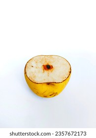 Close-up photo of a pear that has been cut on a white background
