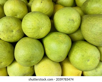 Close-up photo of pomelos in market. The pomelo is commonly consumed and used for festive occasions throughout Southeast Asia.Chinese and Taiwanese will eat pomelo on Mid-Autumn Festival.