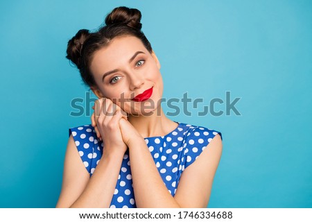 Closeup photo of pretty charming lady red pomade hold hands near face overjoyed thankful affectionate wear dotted white retro blouse shirt isolated blue color background