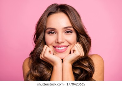 Closeup photo of pretty funny wavy lady overjoyed facial expression arms on cheeks dreamer affectionate emotions wear white casual singlet isolated pink color background - Powered by Shutterstock