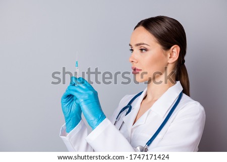 Closeup photo of professional doc serious nurse prepare syringe patient vaccination antibiotic wear latex gloves medical uniform lab coat stethoscope isolated grey background