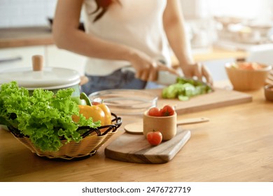 Close-up photo of salad plate There is a picture in the background of a woman doing shortcuts for her health. and holding a tomato home cooking healthy lifestyle Eating healthy food Weight loss formul - Powered by Shutterstock