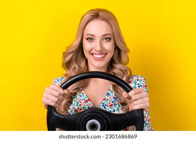 Closeup photo of satisfied rent new automobile blonde attractive girl curls hold steering wheel citroen isolated on yellow color background