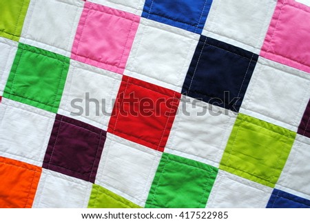 Close-up photo of a simple patchwork quilt