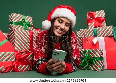 Closeup photo of smile young lady iphone advertisement app store games season sale eshop stack gifts isolated on green color background