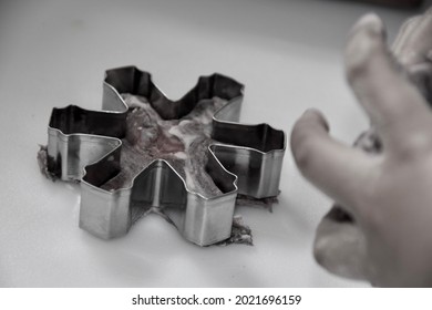 Closeup Photo Of Snowflake Cookie Cutter On Pastry Board.