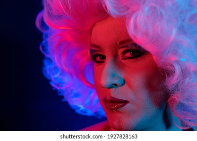 closeup photo studio portrait with gel lights of a drag queen