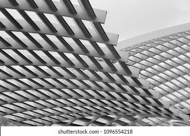 Close-up photo of technological metal grid structure. Abstract black and white background image on the subject of modern architecture, industry or technology.
