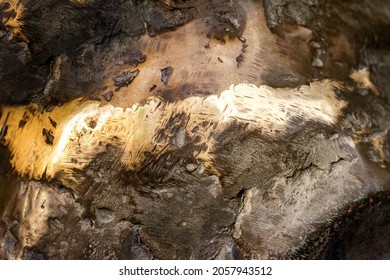 Close-up Photo Texture Of Copper Or Bronze Statue Material With Folds.