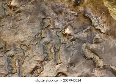 Close-up Photo Texture Of Copper Or Bronze Statue Material With Folds.