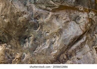 Close-up Photo Texture Of Copper Or Bronze Statue Material With Folds.