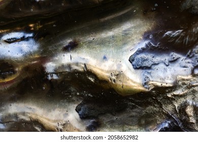 Close-up Photo Texture Of Copper Or Bronze Statue Material With Folds.