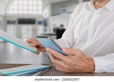 Closeup Photo Of Traveling Man Searching Flight Schedule For International Travel