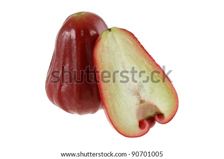 Closeup photo of tropical fruit with one cut in half - sweet ripe Rose Apple, also called water Apple or Chompoo fruit in Thai, isolated on white background