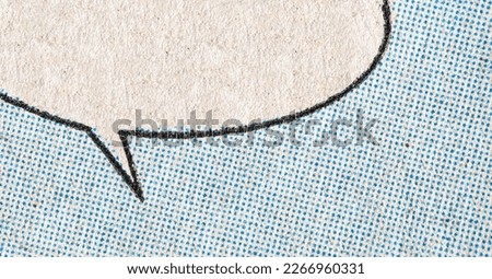 Closeup photo of a vintage comic book page with blue dot printing pattern and empty speech bubble on a paper texture background
