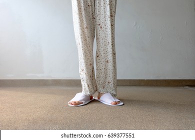 woman wearing slippers