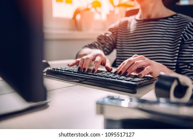 Closeup photo of woman using computer at the office
