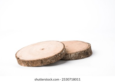 Close-up photo of Wooden cutting board or drink coaster made from cutted whole tree trunk isolated on white background. Shot on 30 degree angle setup. - Powered by Shutterstock