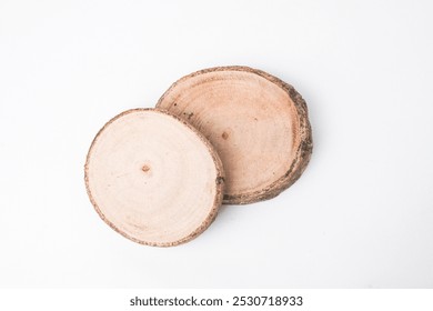 Close-up photo of Wooden cutting board or drink coaster made from cutted whole tree trunk isolated on white background. Shot on High angle flat lay setup. - Powered by Shutterstock