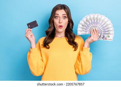 Closeup photo of young adorable pretty cute nice funny woman hold cash pouted lips credit card black friday surprised shopaholic isolated on blue color background