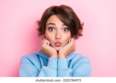 Closeup Photo Of Young Gorgeous Nice Pretty Woman Wear Blue Sweater Touch Cheeks Hands Air Kiss Pouted Lips Flirty Isolated On Pink Color Background